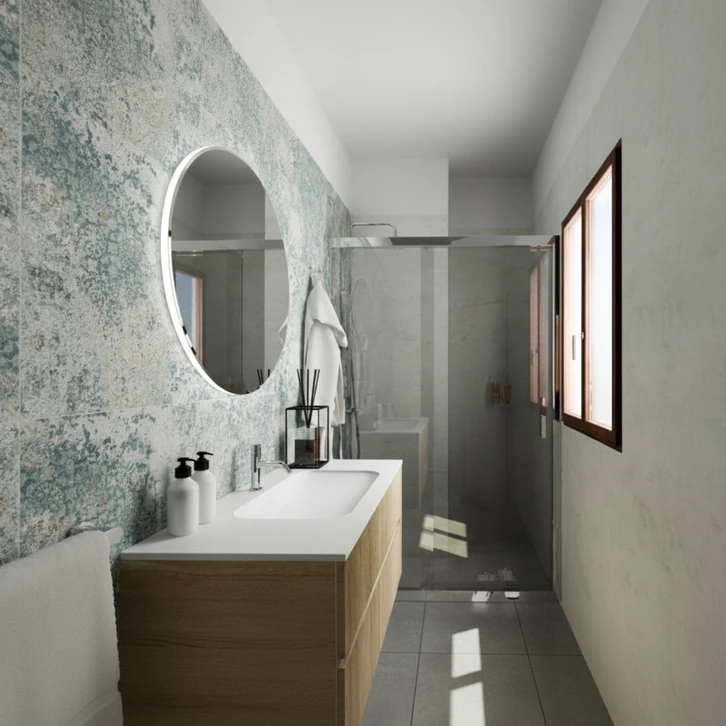 Artisan carreleur en salopette kaki posant des carreaux sur chantier de rénovation intérieure